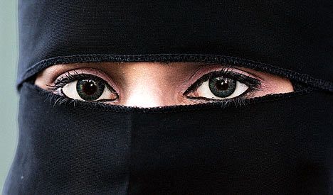 women with face cover veil